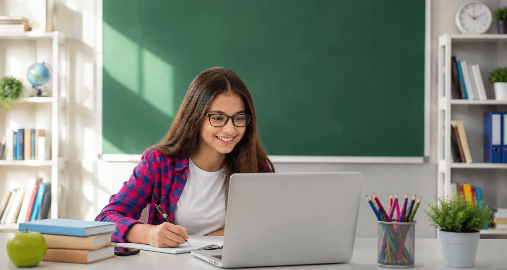 A male teacher helping a female student